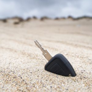 Car key lost in the sand on the beach