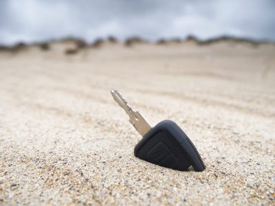 Car key lost in the sand on the beach